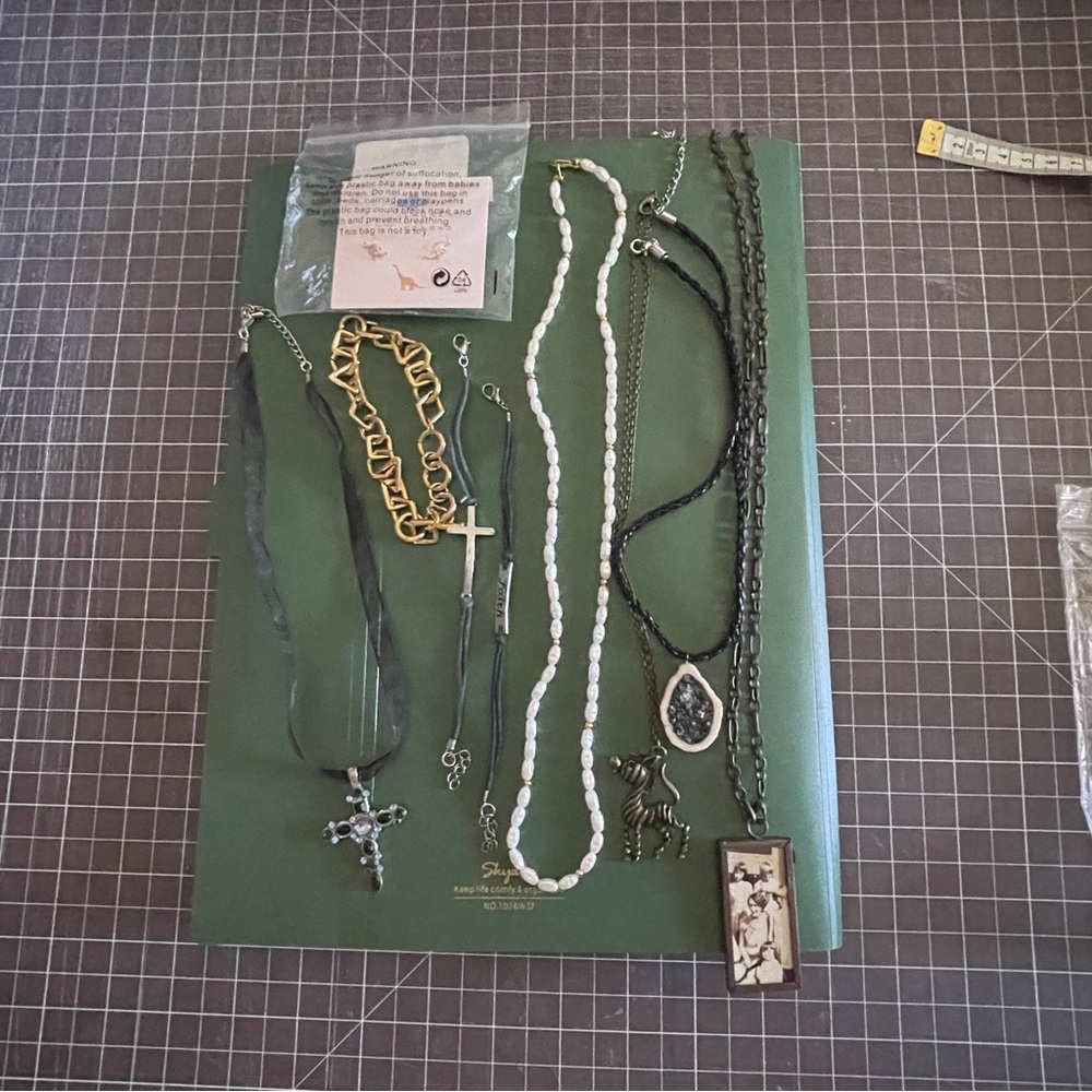 Assorted necklaces, choker, bracelets and gold dinosaur posts